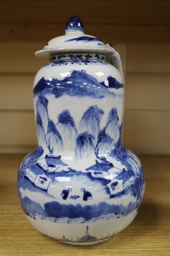 A Chinese blue and white gourd-shaped vase and cover, late 19th century, height 28cm